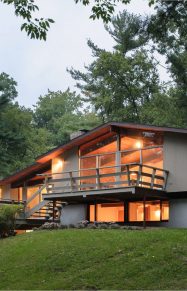 mid-century modern exterior glowing at dusk