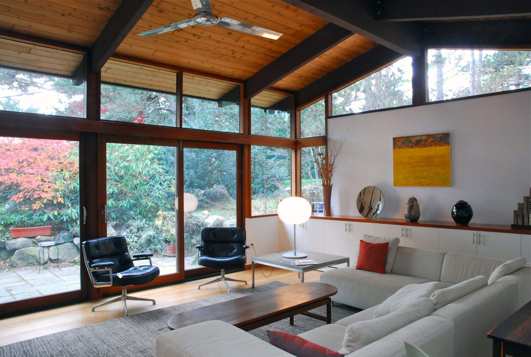 mid-century modern furnished interior large windows