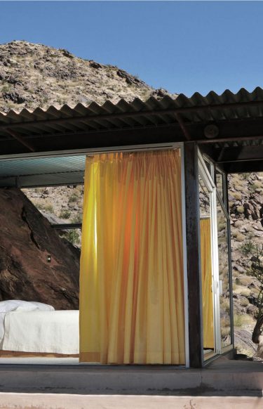 home exterior with cantilevered corrugated metal roof