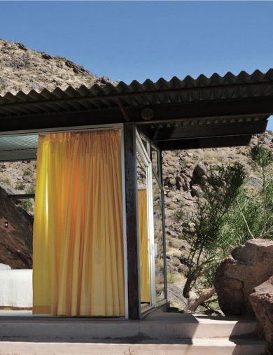 home exterior with cantilevered corrugated metal roof