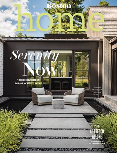 boston home magazine cover with outdoor landscape pavers leading to sitting area