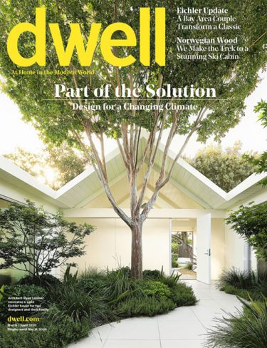 dwell cover with treed courtyard and gable roofed home