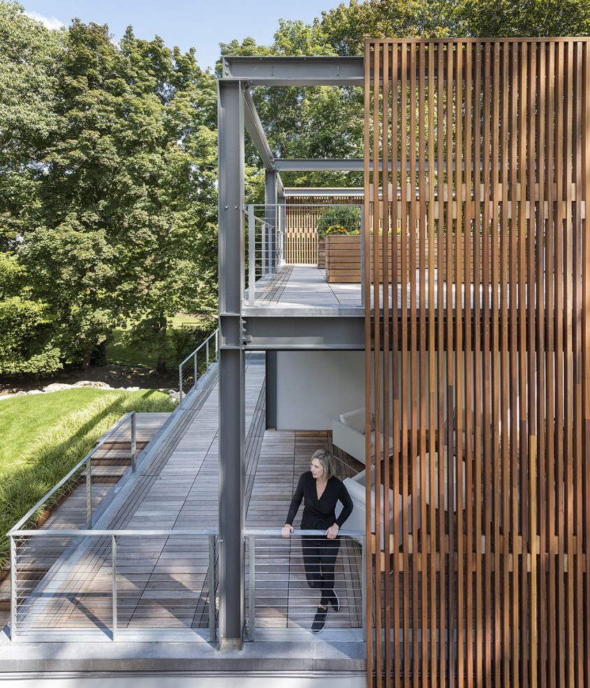 exposed steel structure rooftop garden and open-air veranda with wood screen