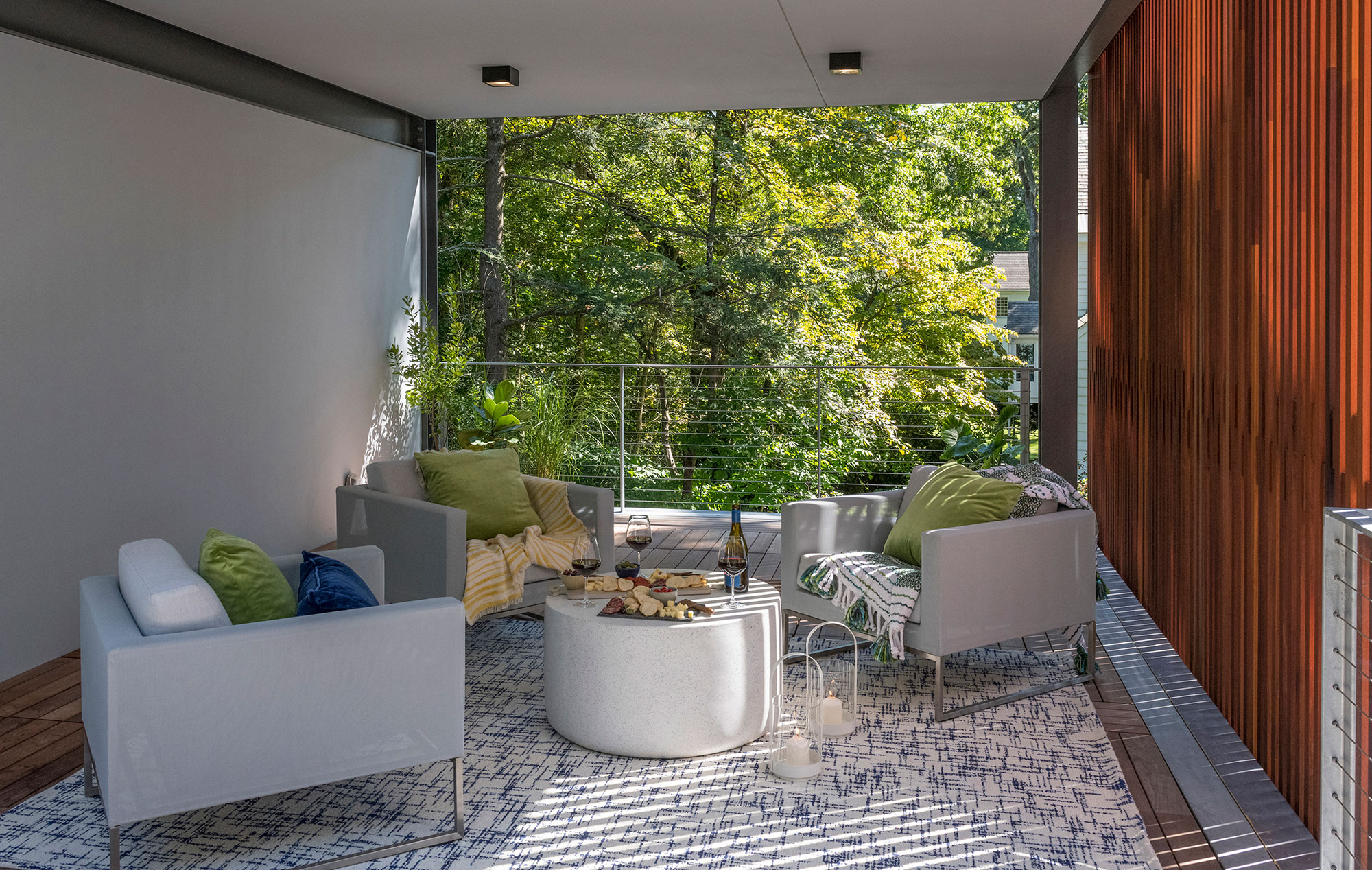 furnished open-air veranda with privacy wood screen