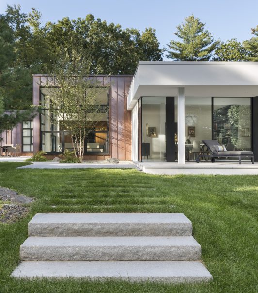 copper cladding with stucco and glass addition
