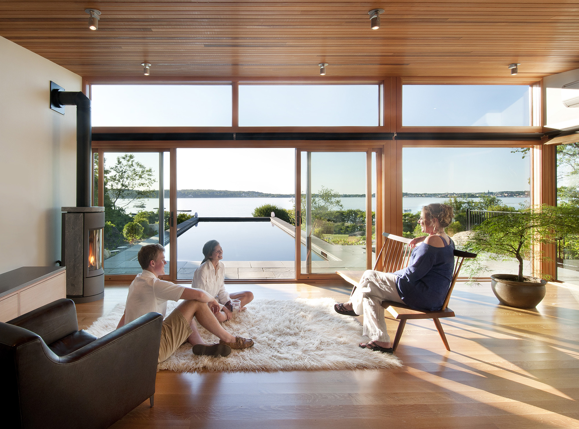 oceanside poolhouse interior of cabana with wood burning stove
