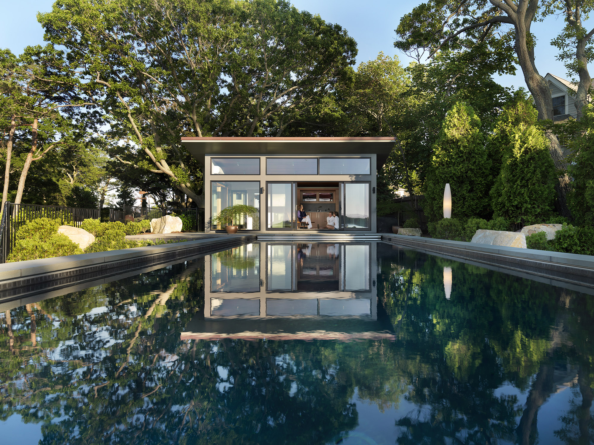 poolhouse cabana surrounded by trees