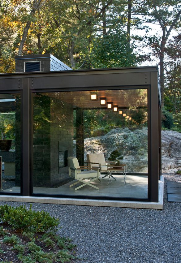 meditation studio with fireplace made of steel and glass