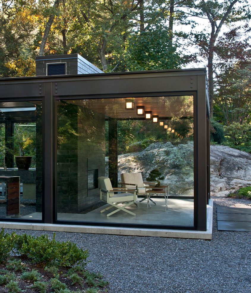 meditation studio with fireplace made of steel and glass