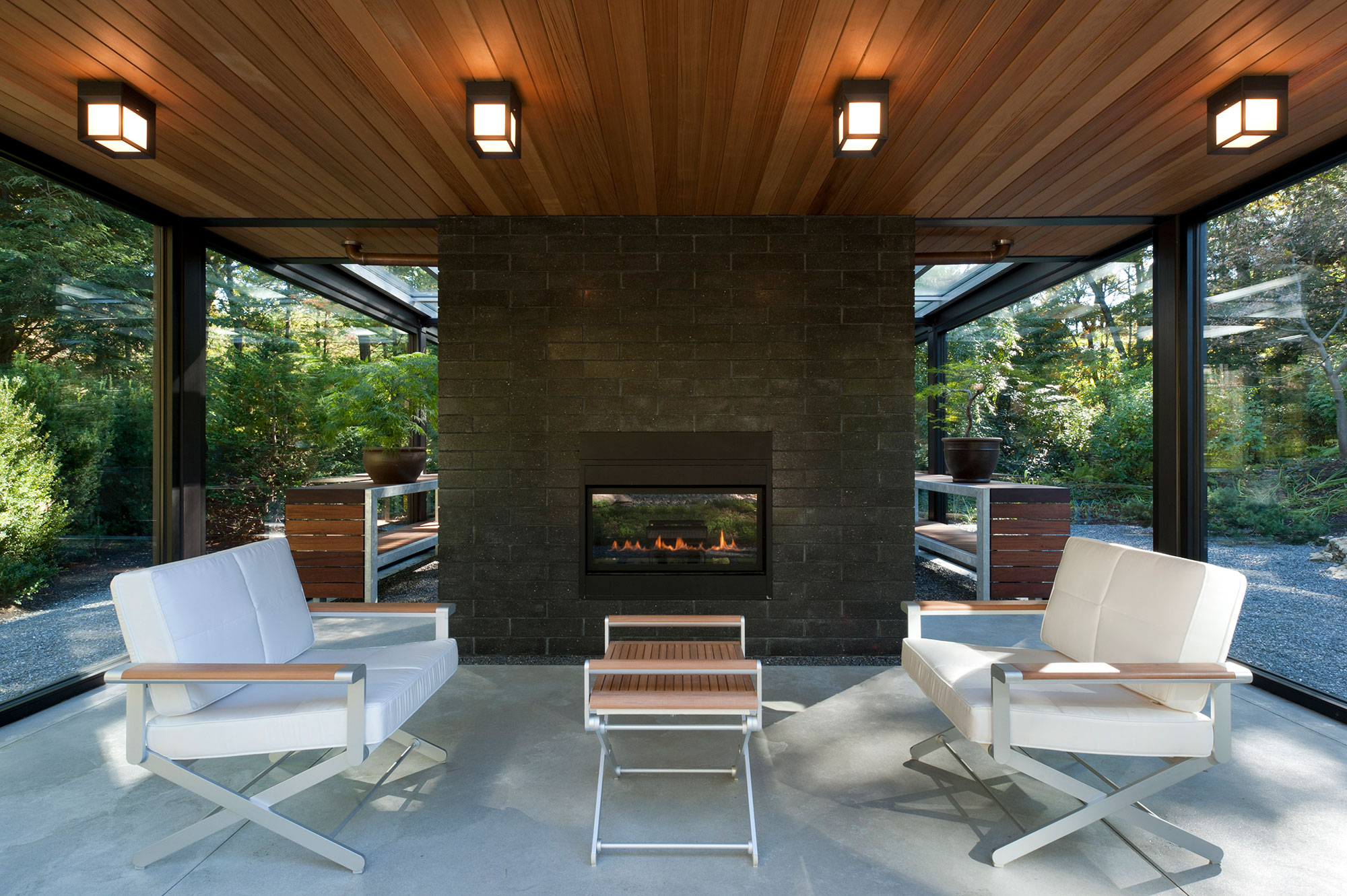 meditation studio with fireplace and connected bonsai greenhouse