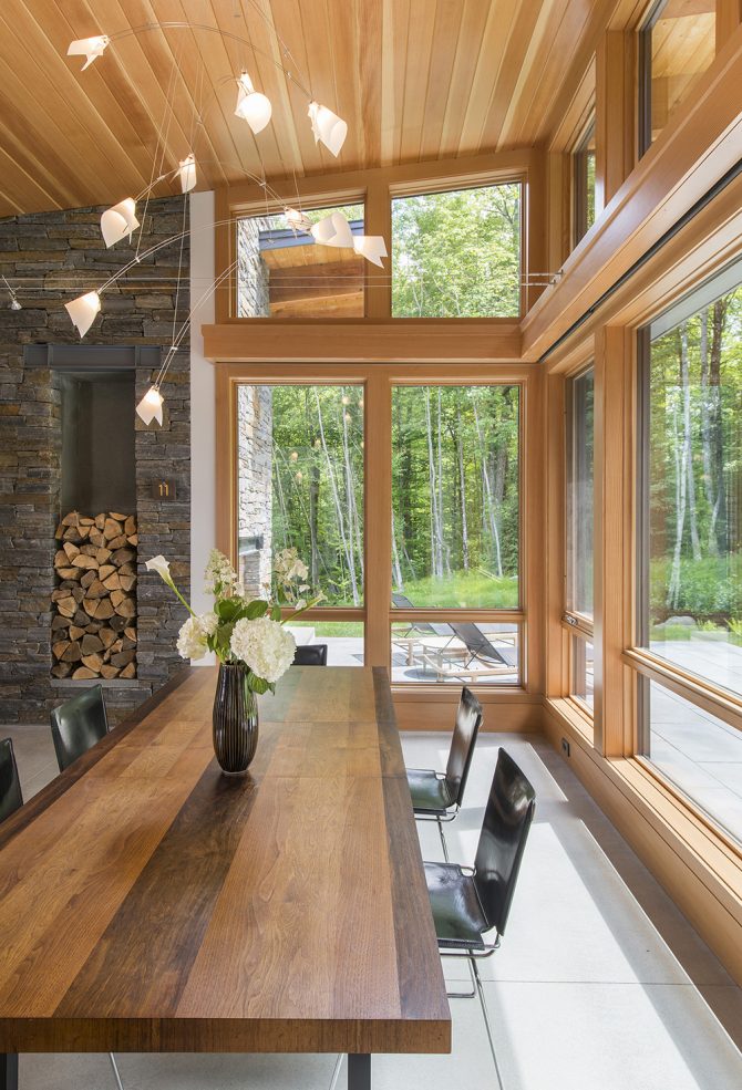open layout with dining room view of surrounding woods