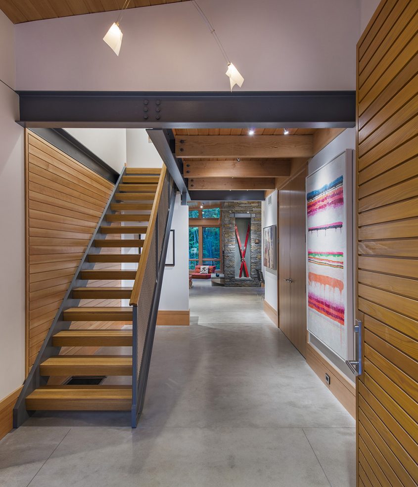 ski chalet entry with wood stair exposed steel