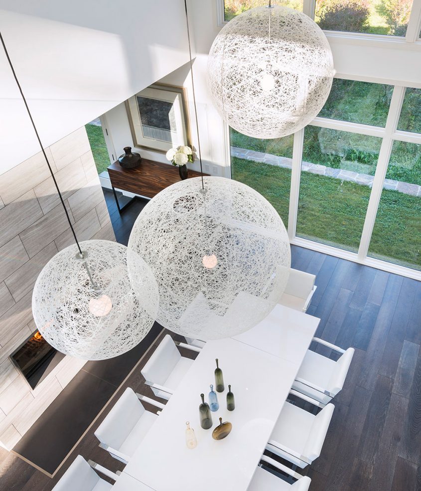 view of dining room from interior balcony and moooi pendant detail