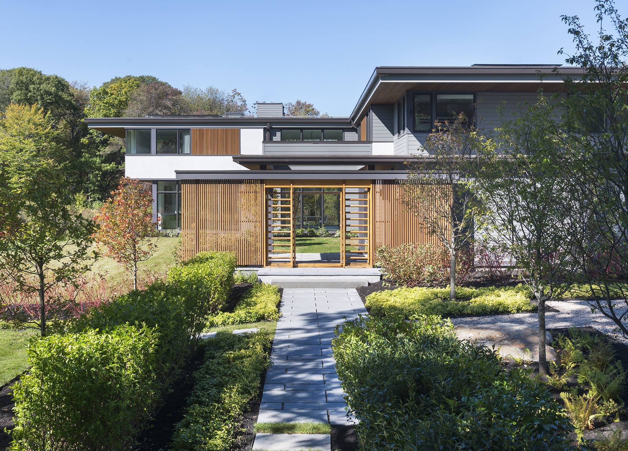 japanese inspired screen entry to modern courtyard
