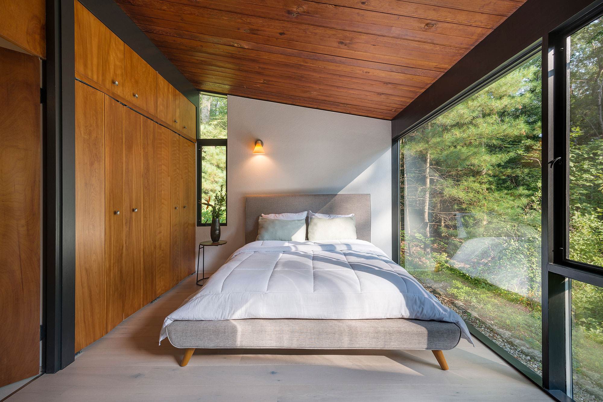 mid-century modern master bedroom large windows