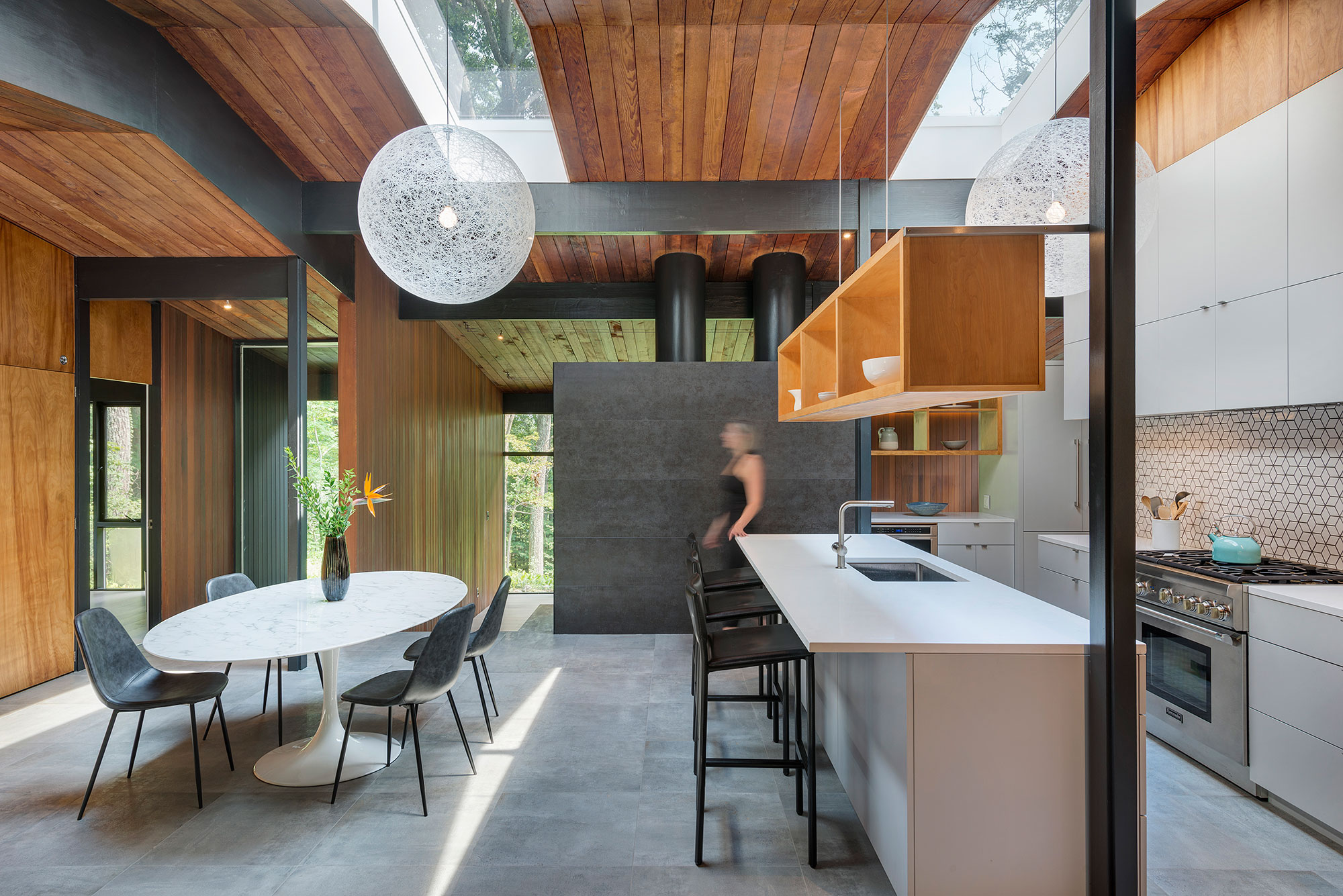 mid-century modern island kitchn with skylights