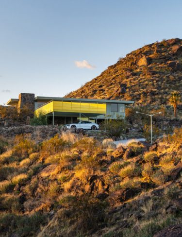 mid-century modern in the hilly desert landscape