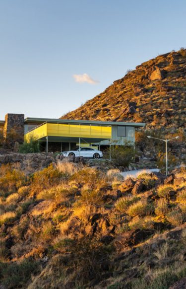 mid-century modern in the hilly desert landscape