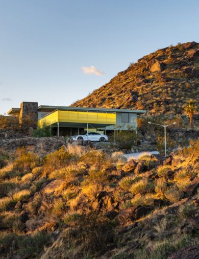 mid-century modern in the hilly desert landscape