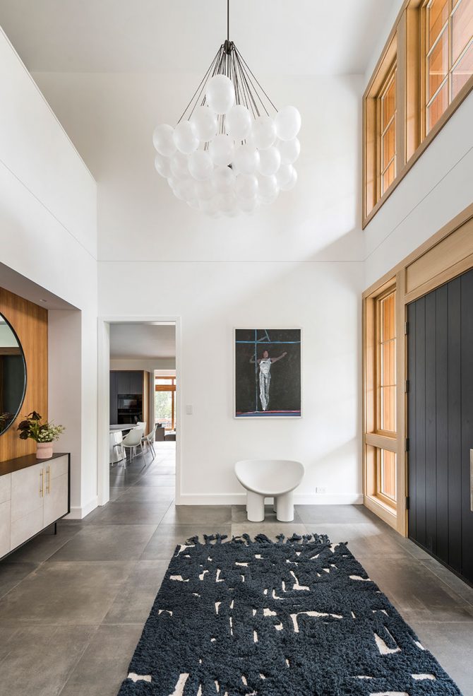 cathedral ceiling foyer with modern ball chandelier