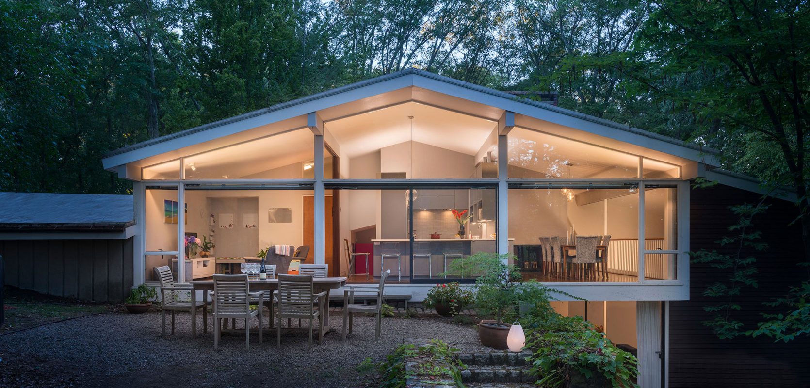 mid-century modern exterior with glass walls