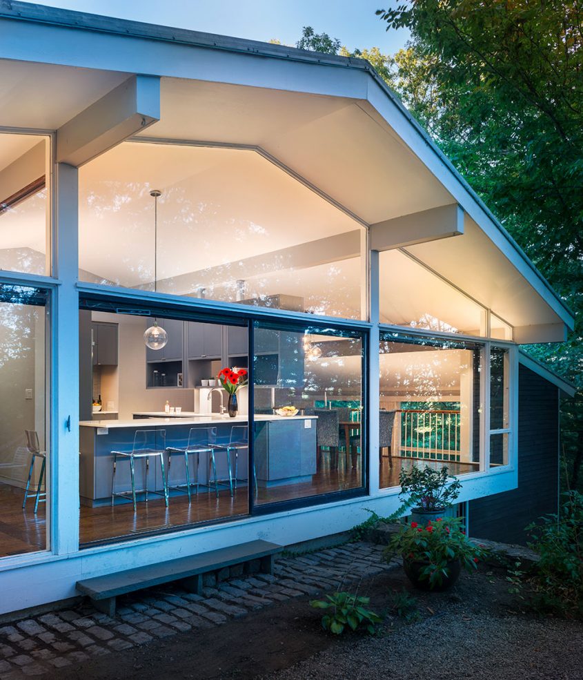 exterior of mid-century modern glass walls with exposed beams