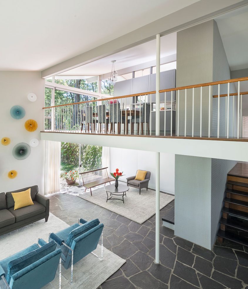 mid-century modern interior balcony overlooking living room