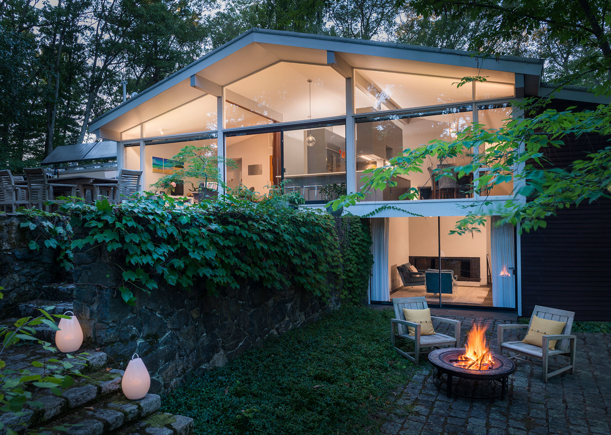 exterior of mid-century modern glass walls with exposed beams