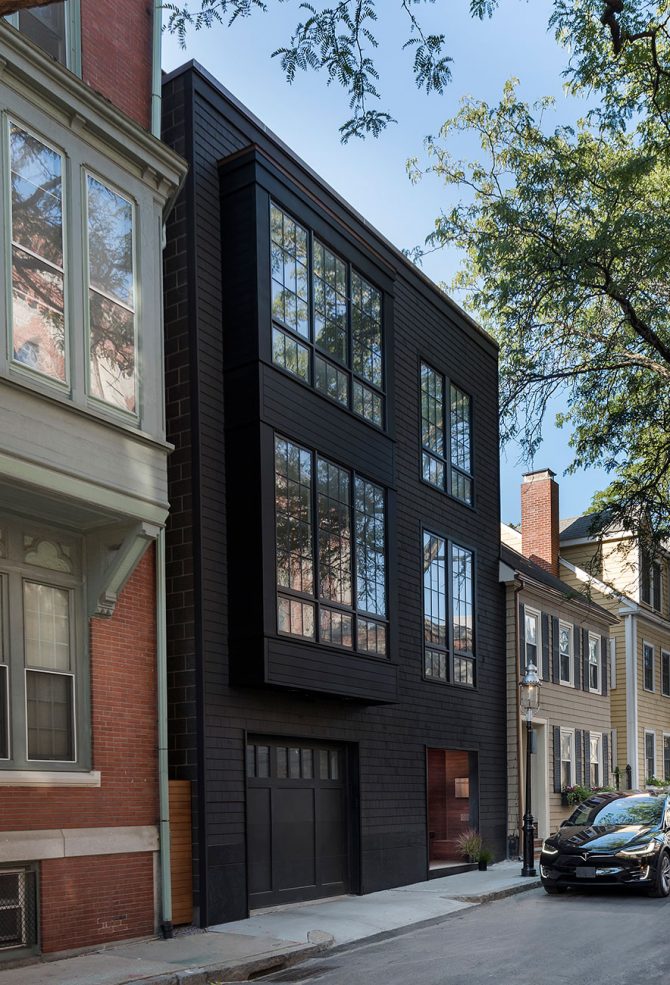 modern exterior of black 3-story row house