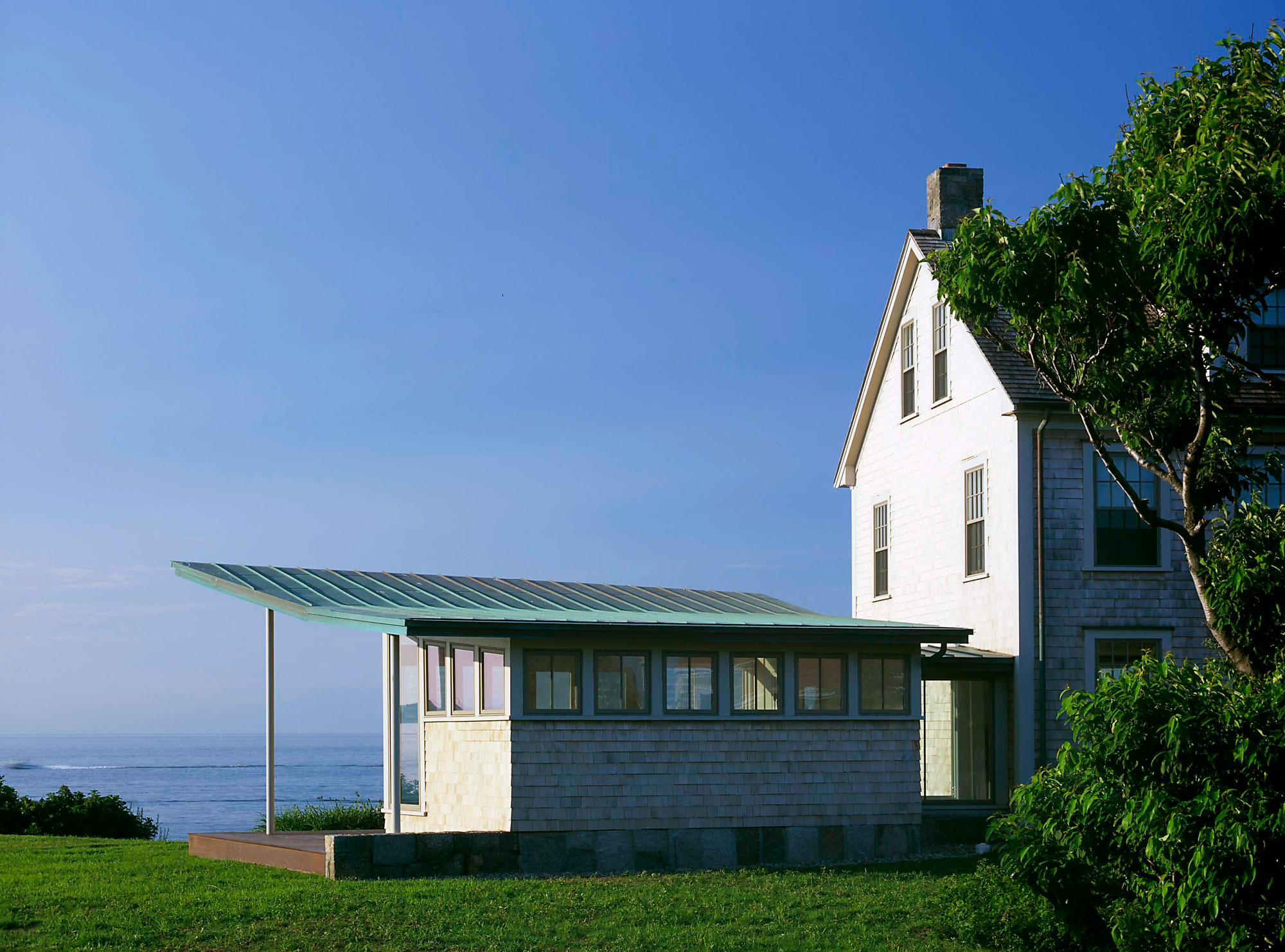 exterior addition with metal cantilevered roof