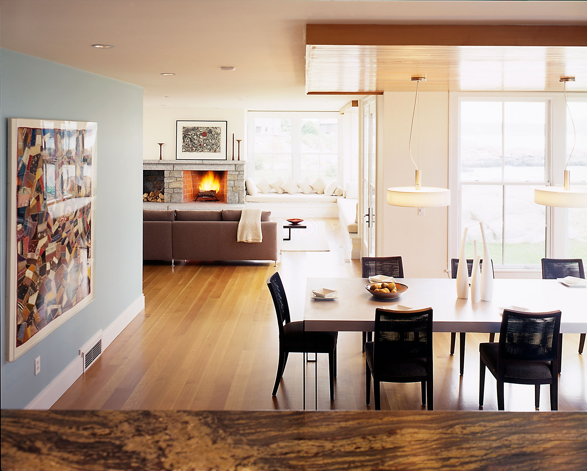 interior of dining room and living room with fireplace