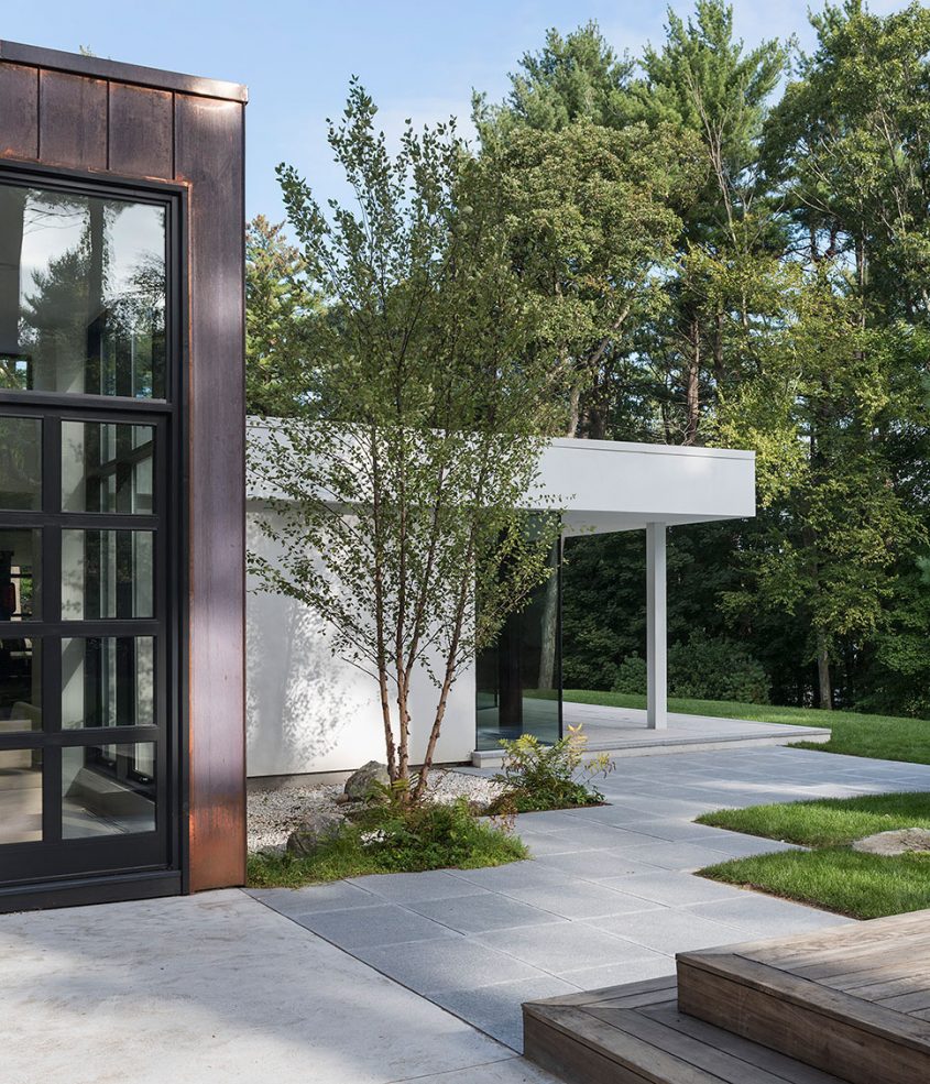 copper clad home with stucco and glass addition