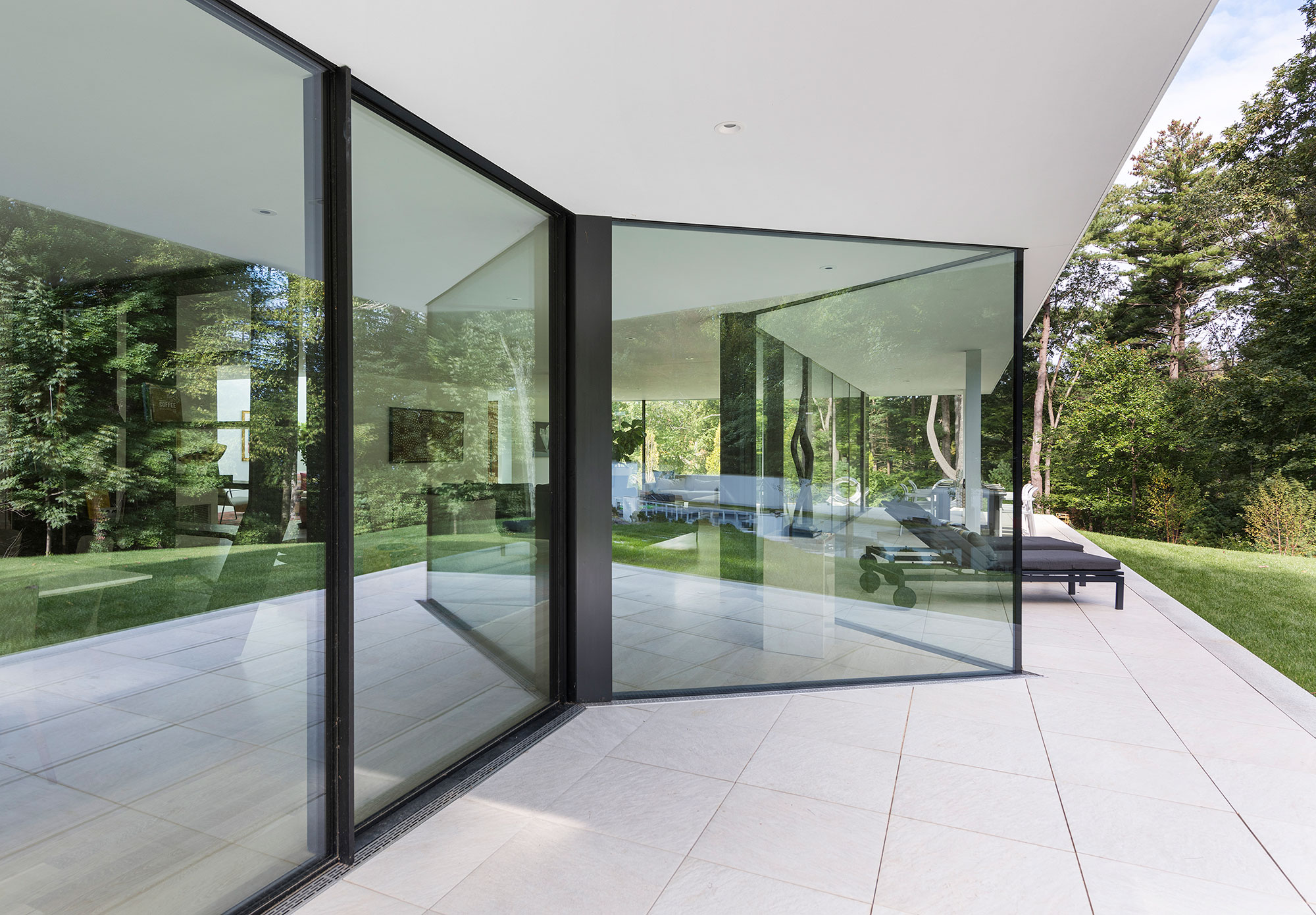 glass triangle on terrace with cantilevered roof