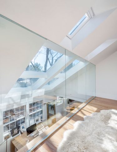 interior glass wall balcony with skylights