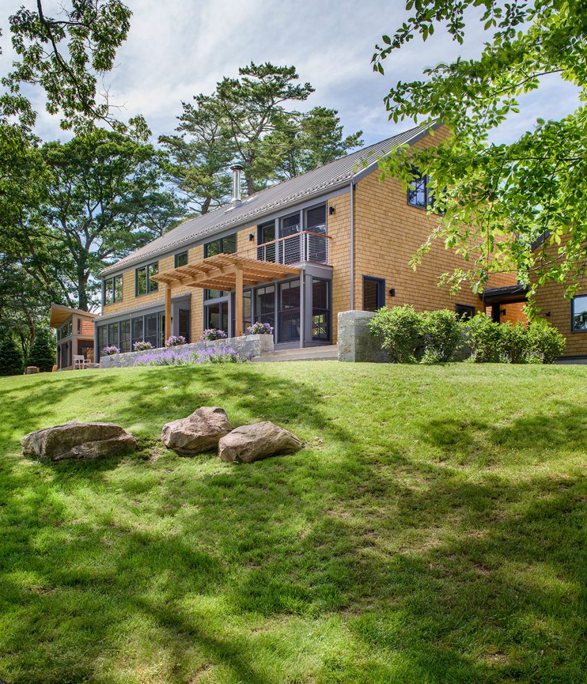 exterior of modern farmhouse with cedar shingles