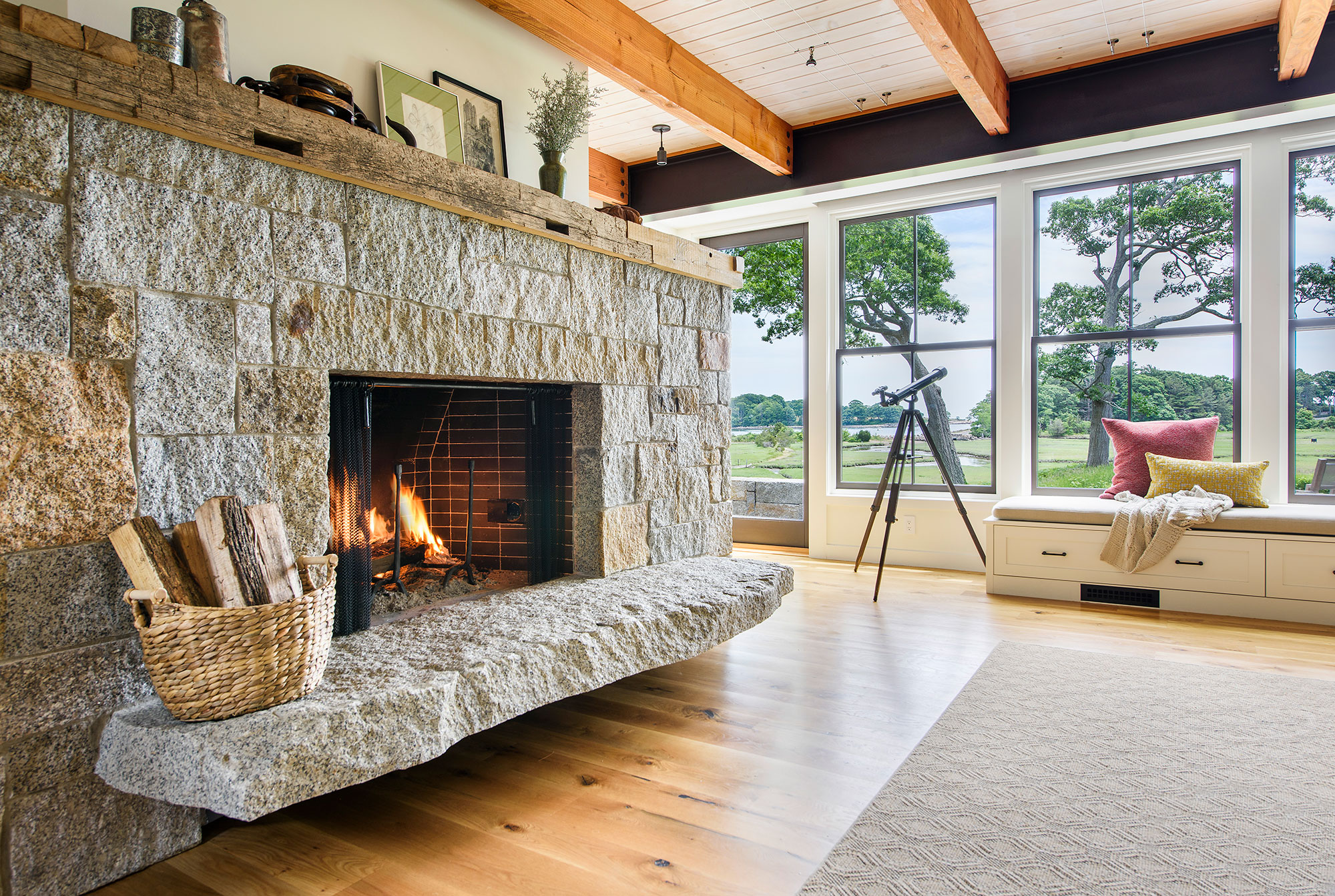 large natural stone fireplace and reclaimed railroad tie mantle