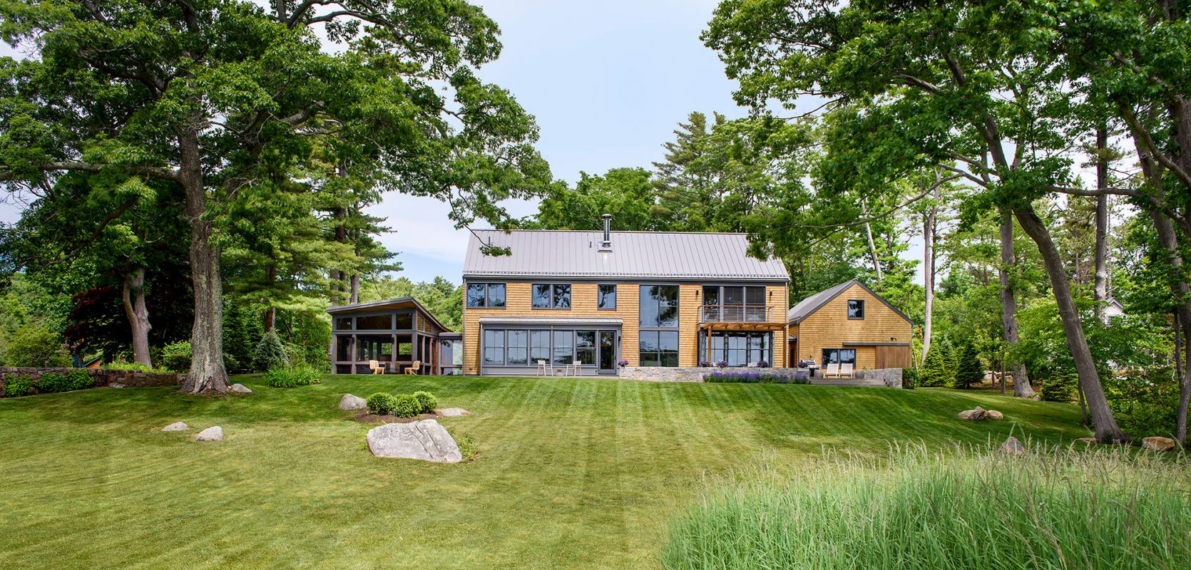exterior of modern farmhouse with cedar shingles