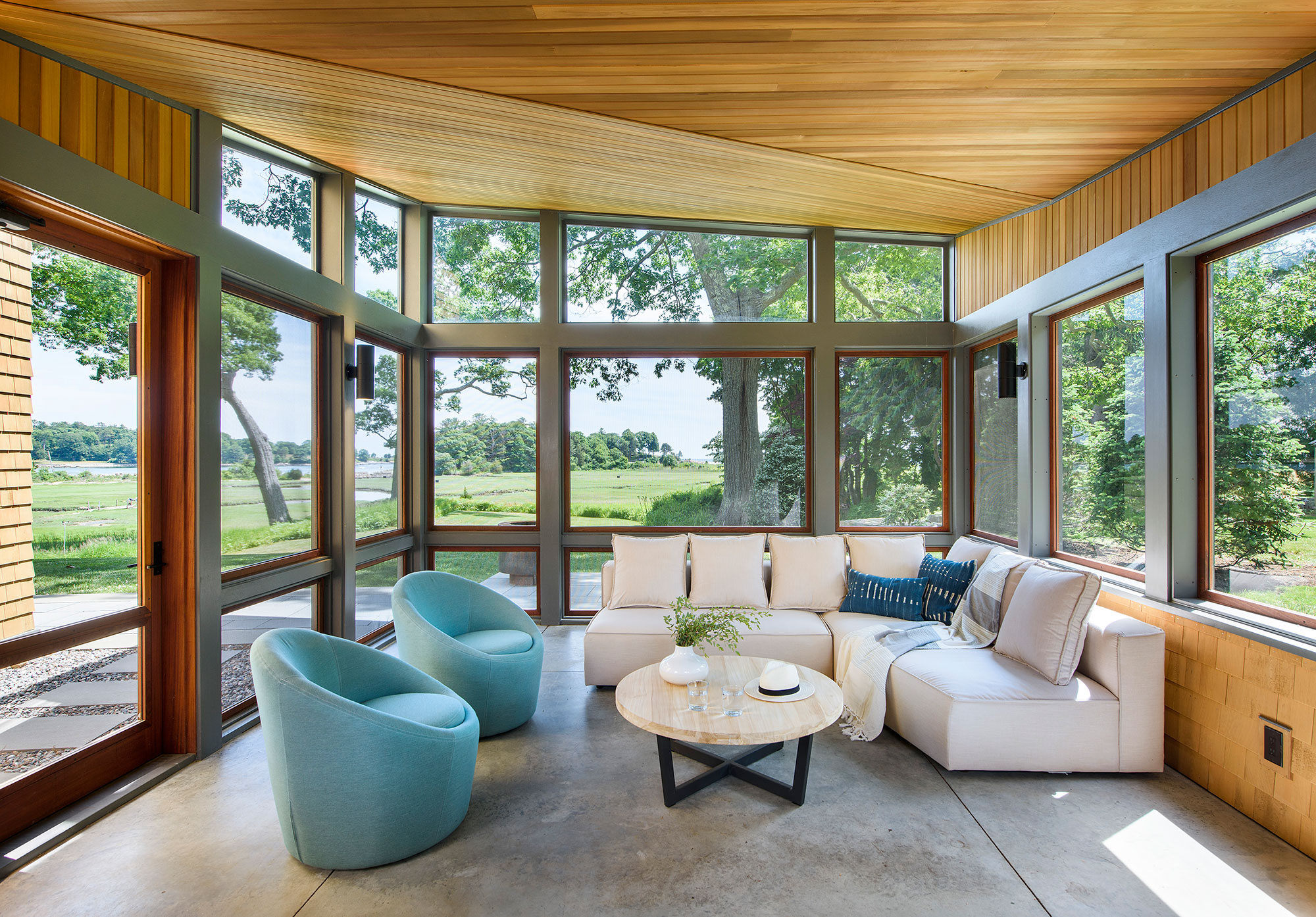 interior of screen porch with seating