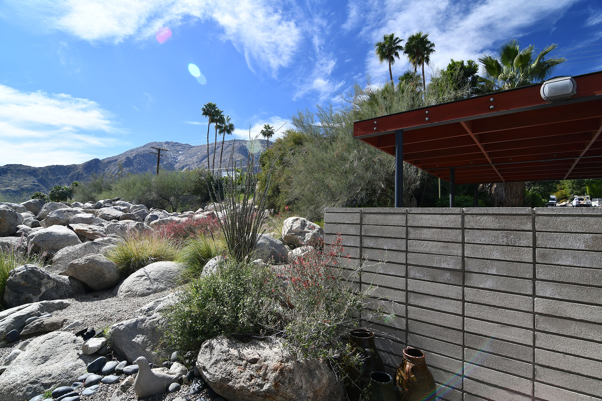 carport exterior of home with desert landscape