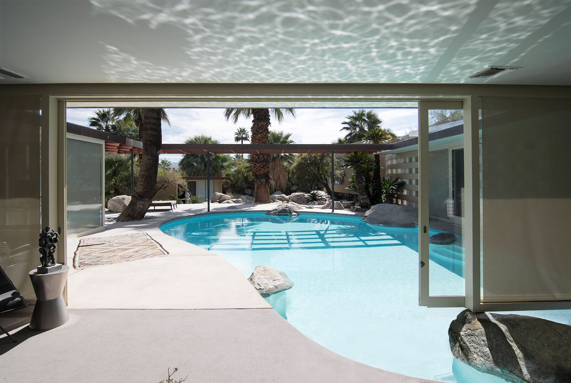 mid-century modern home with pool in living room