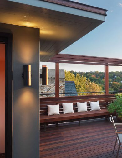 roof top view with built-in bench and tree tops in the distance