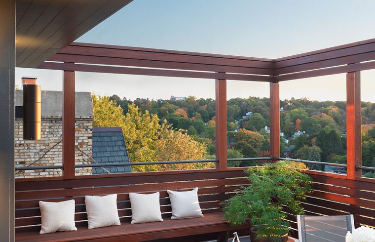 roof top view with built-in bench and tree tops in the distance