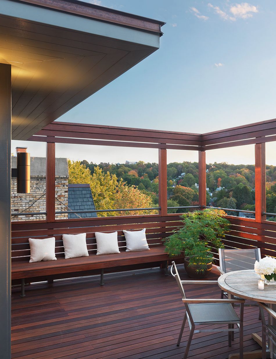 roof top view with built-in bench and tree tops in the distance