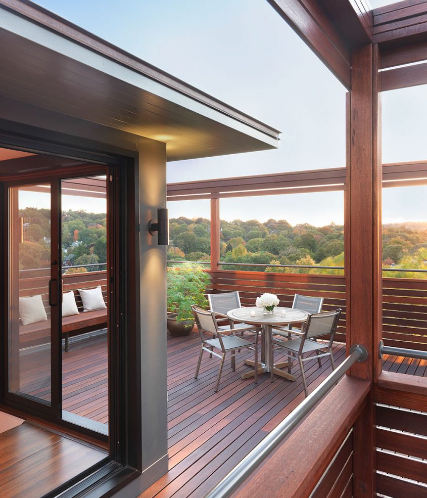 roof top view with built-in bench and tree tops in the distance