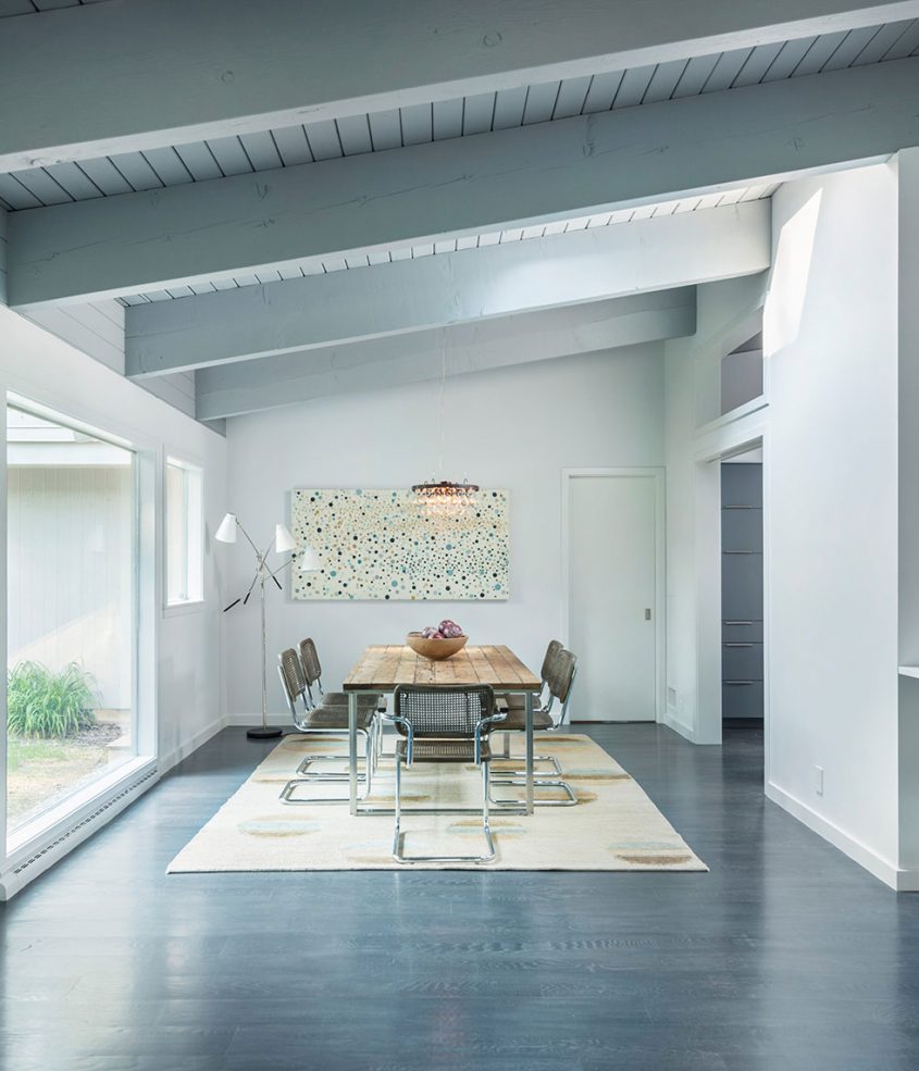 mid-century modern dining room with exposed beams
