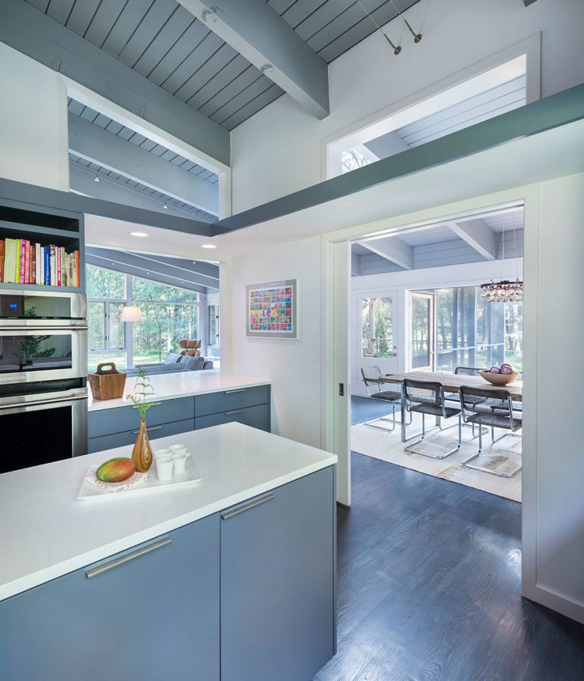 mid-century modern kitchen with pocket doors to dining room