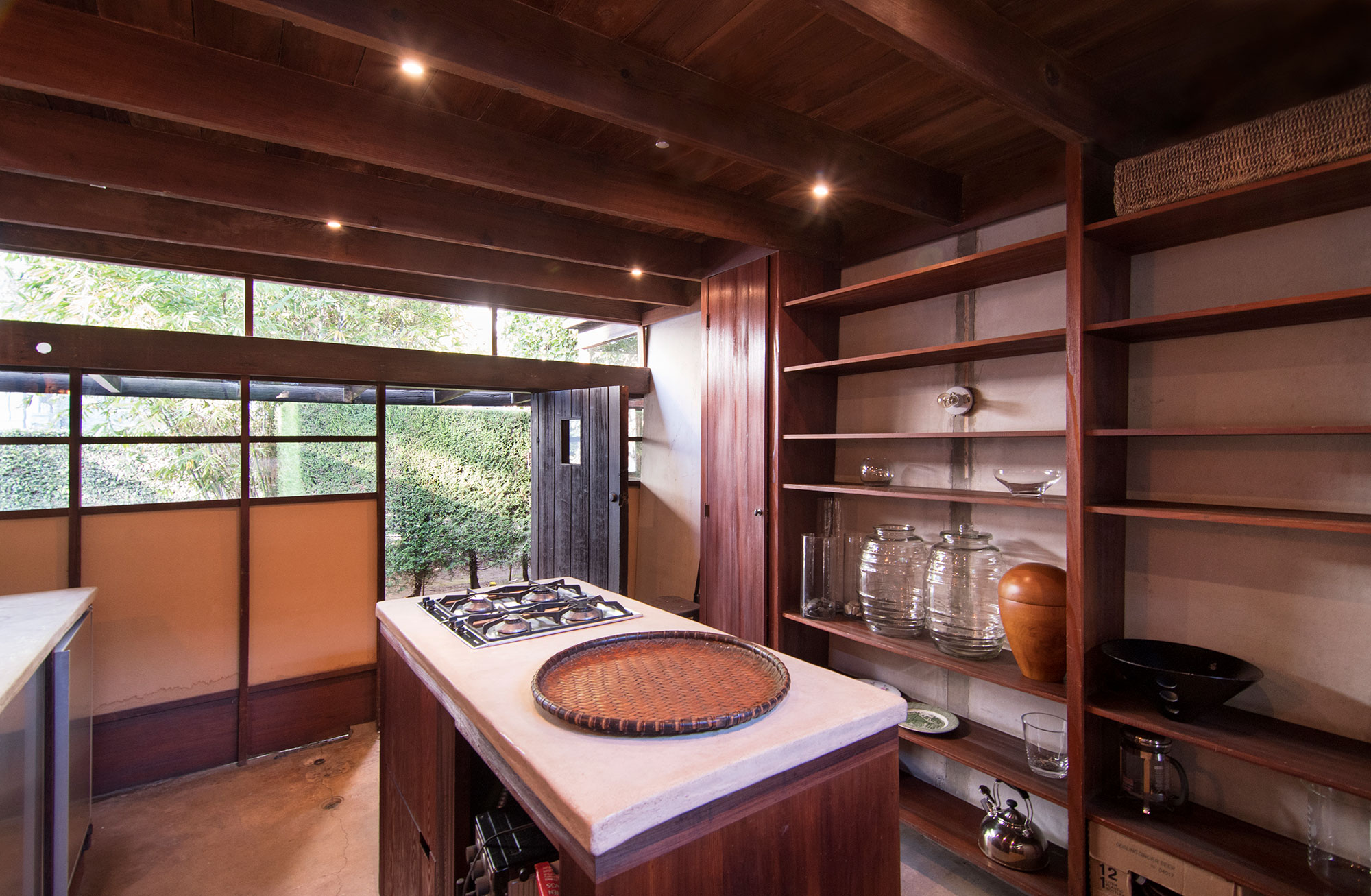 kitchen interior with open shelving of dated home