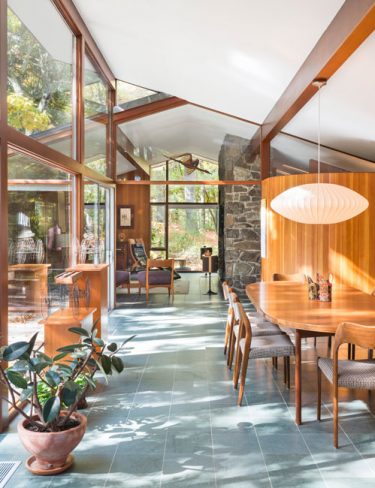 mid-century modern dining room floor to ceiling windows