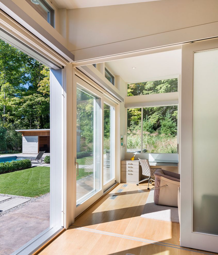 sliding glass doors lead out to swimming pool terrace