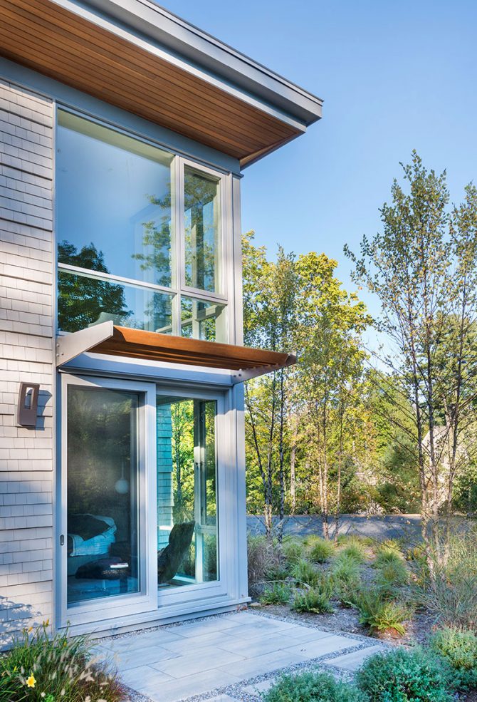 exterior corner of modern home with louvered canopy
